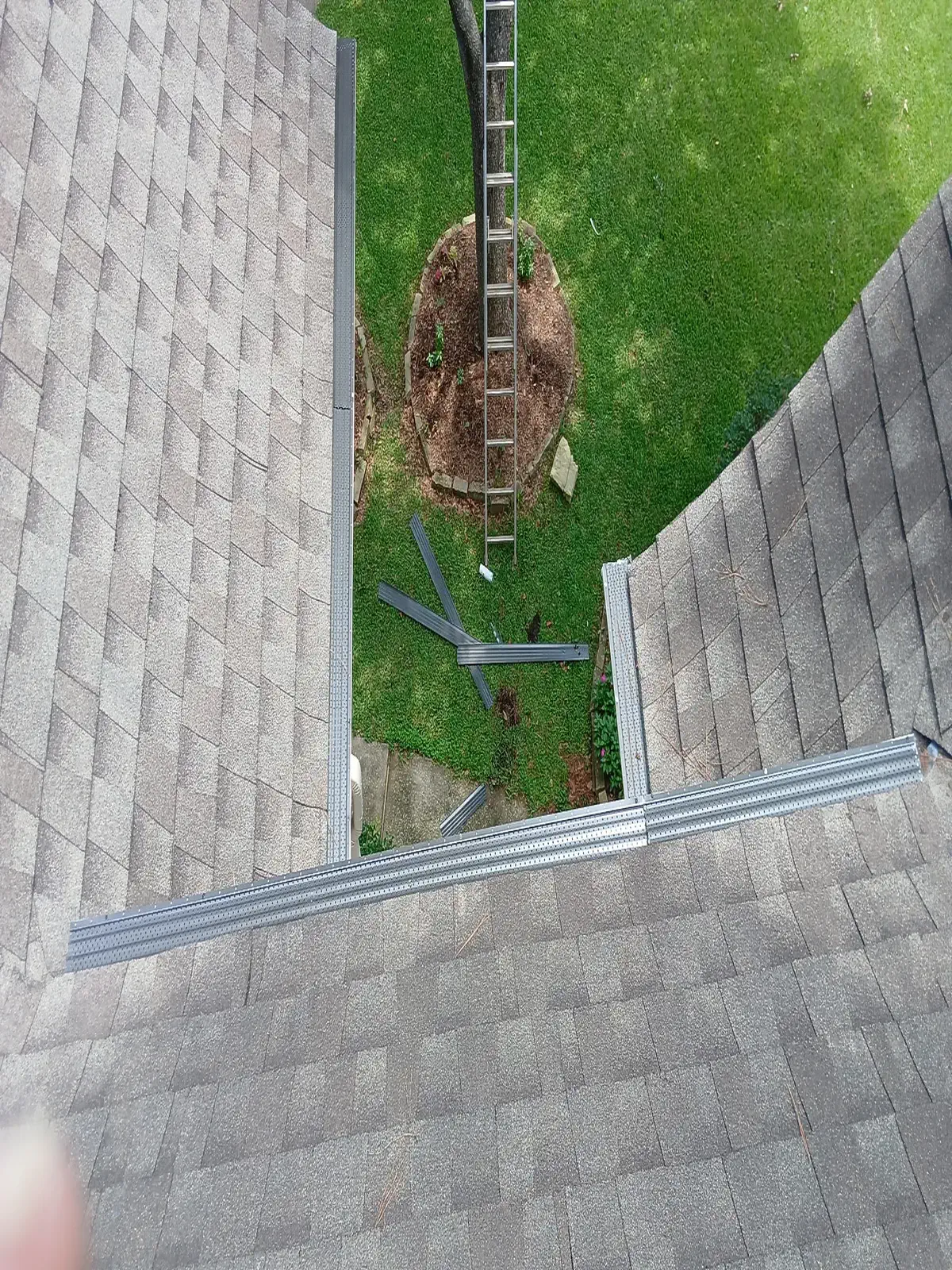 Top view of gutter guards installed on a gutter run