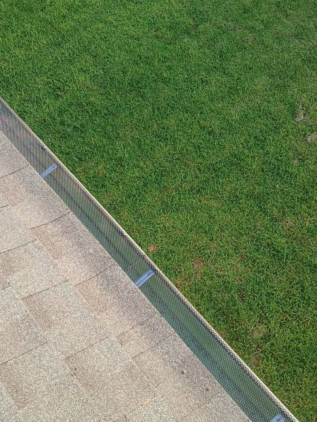 Transparent gutter guards installed in a finished gutter run