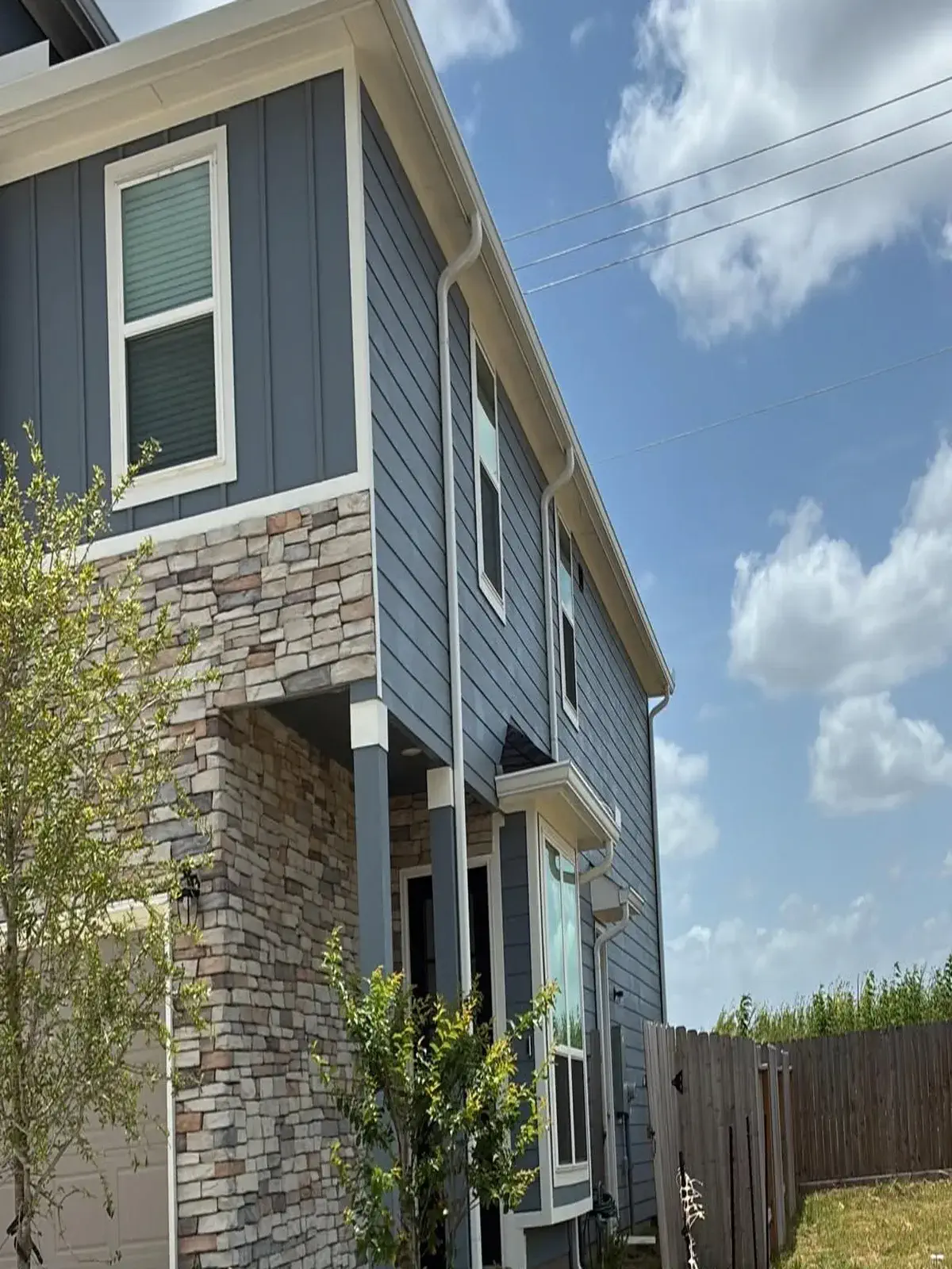 Gutter install on a blue home